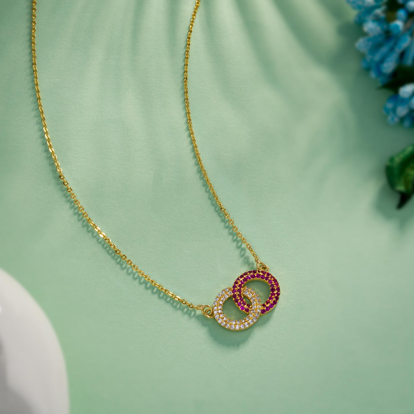 golden necklace with a diamond pendant