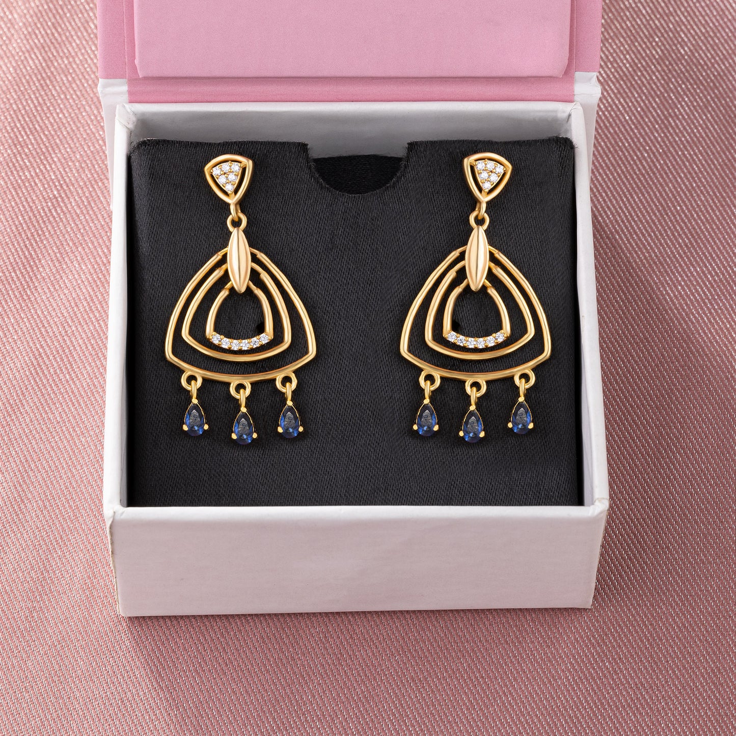 pair of golden earrings with diamonds