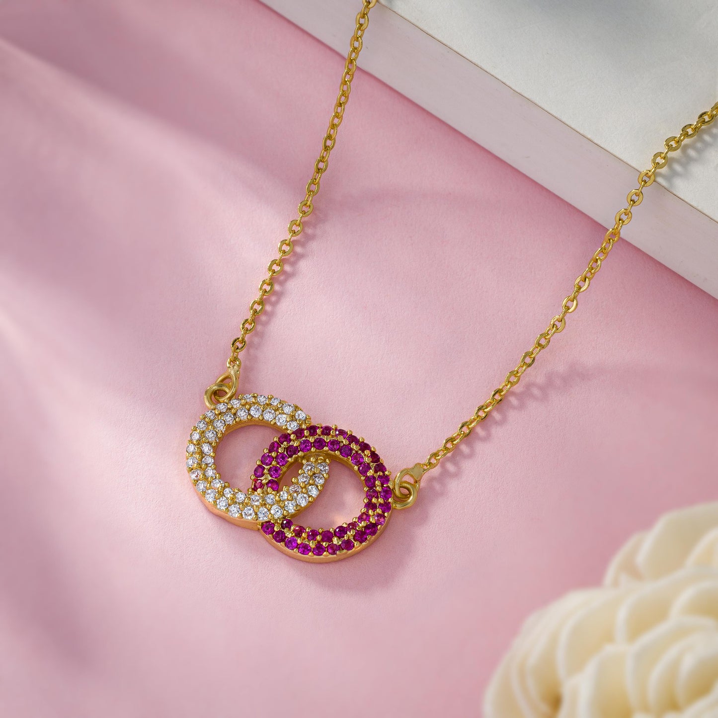 golden necklace with a diamond pendant