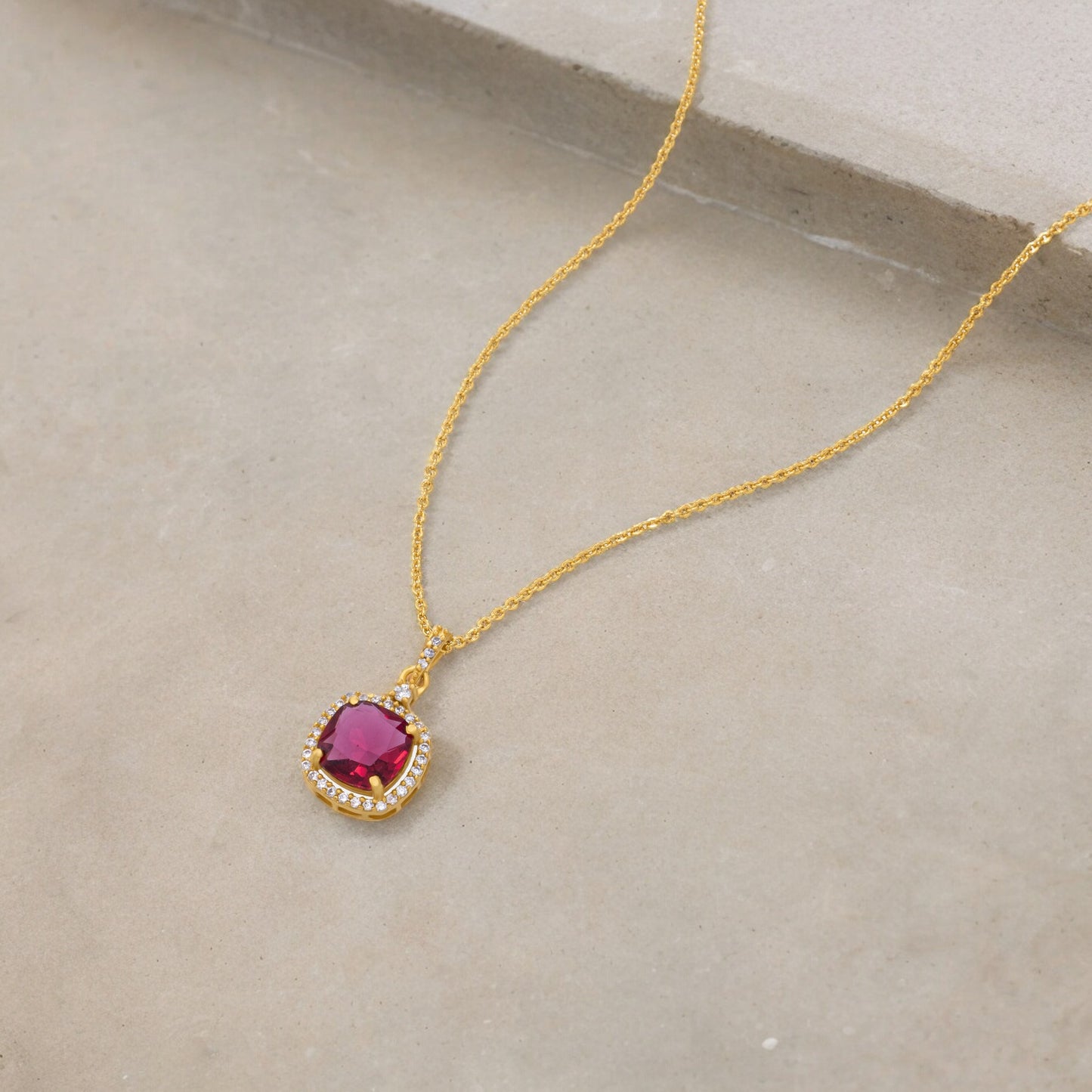 golden necklace with stone and diamonds