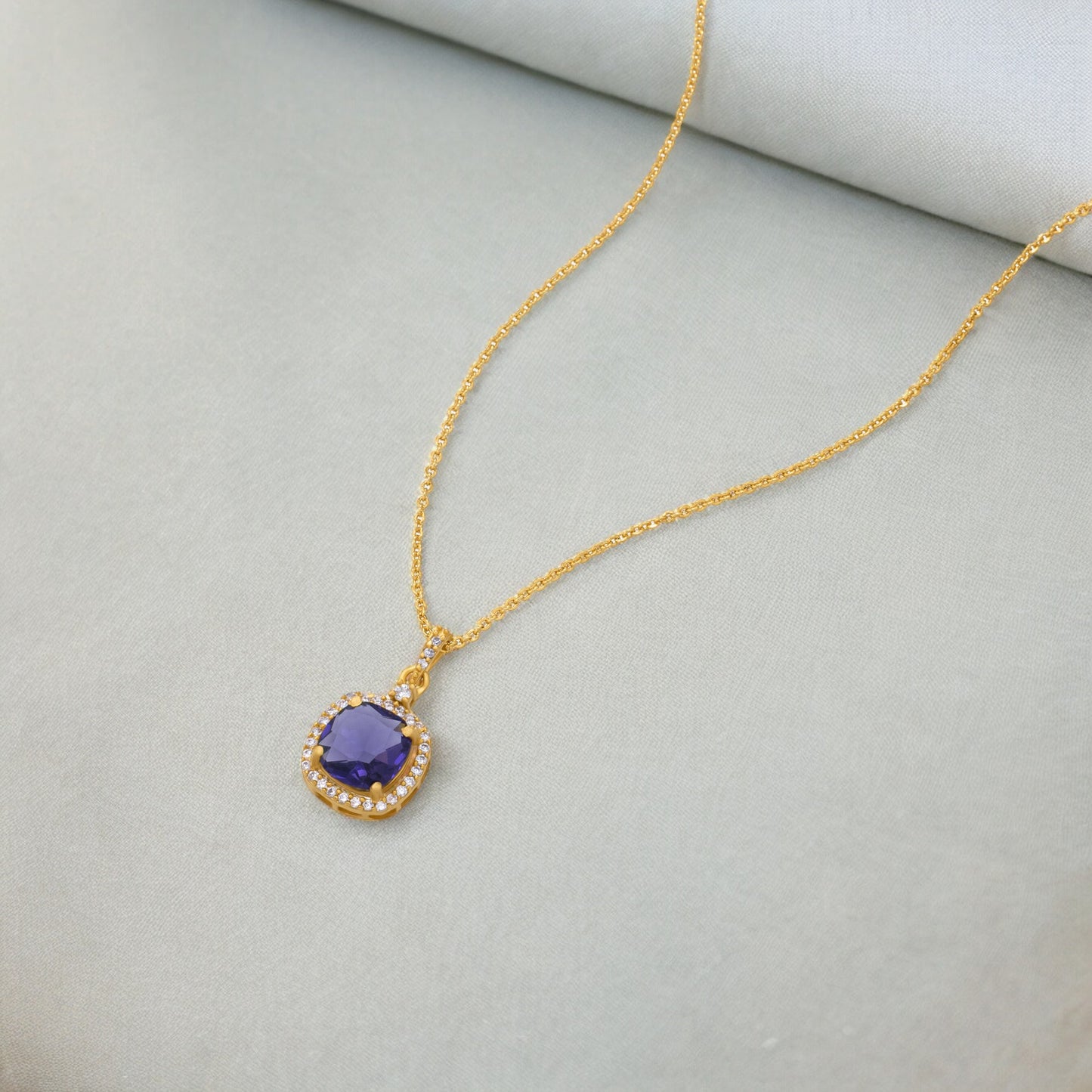 golden necklace with stone and diamonds