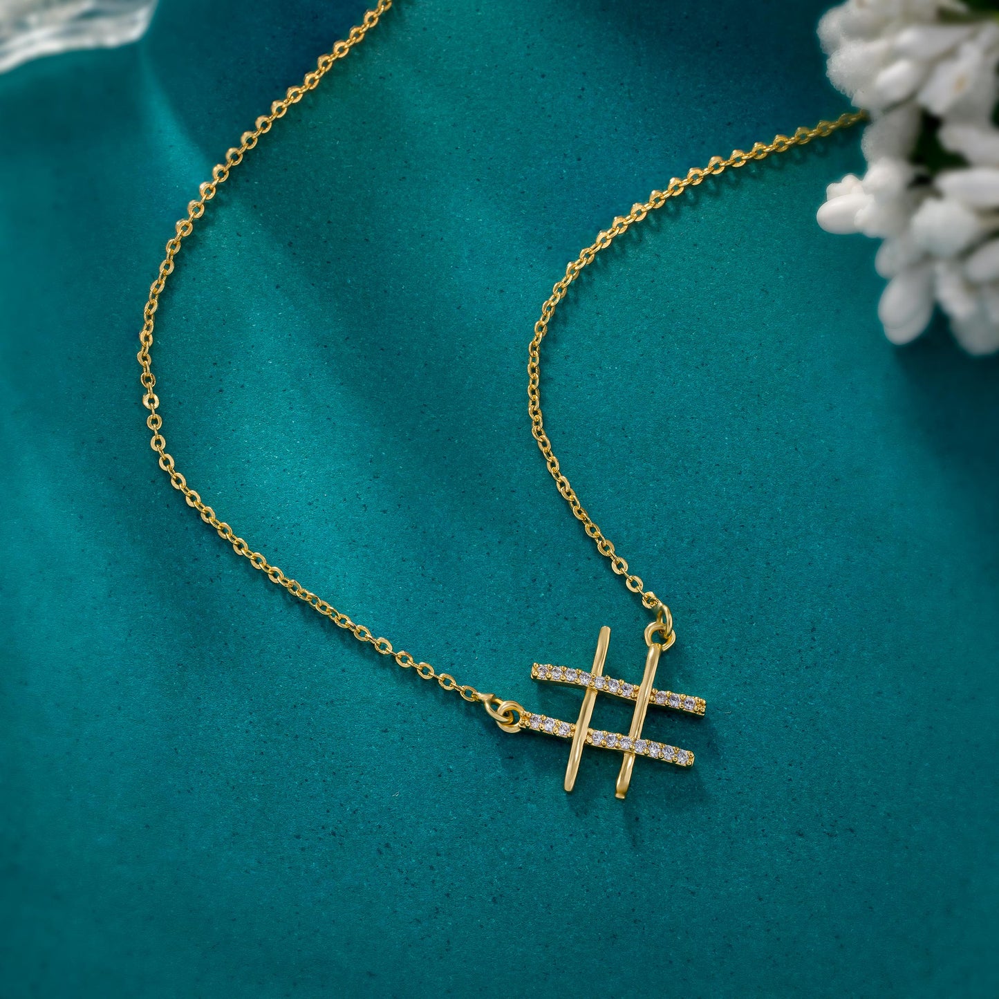 golden necklace with two crossed crosses on it