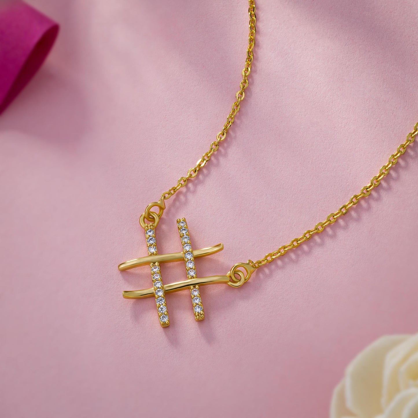 golden necklace with two crossed crosses on it