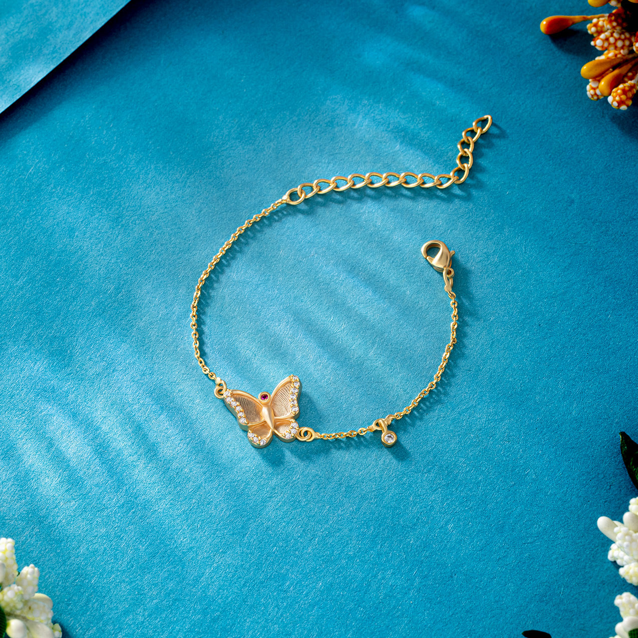 golden bracelet with a butterfly charm