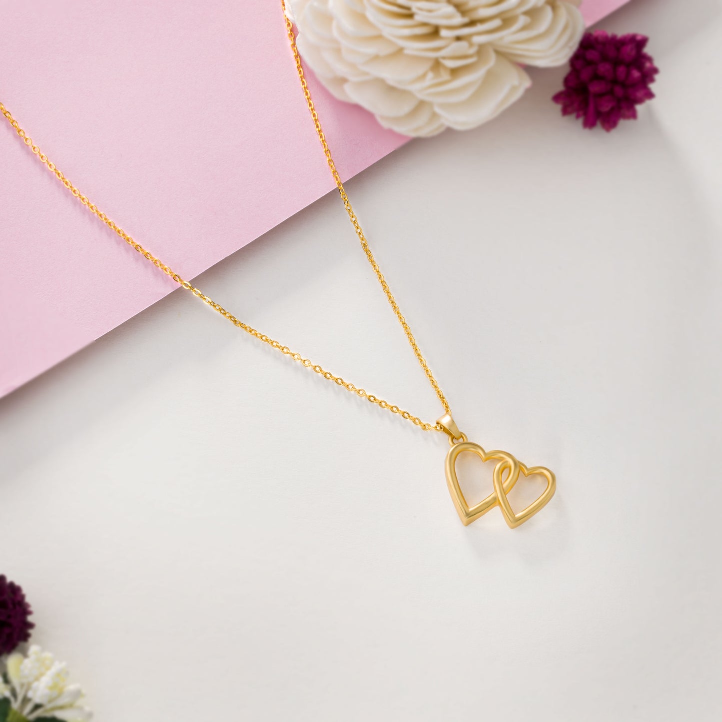 golden heart pendant with a chain