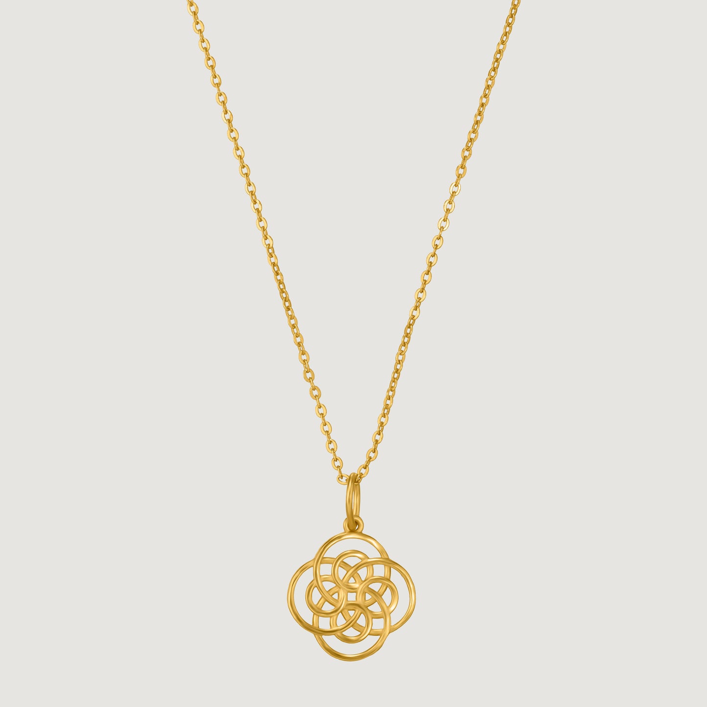 golden necklace with a knot on it