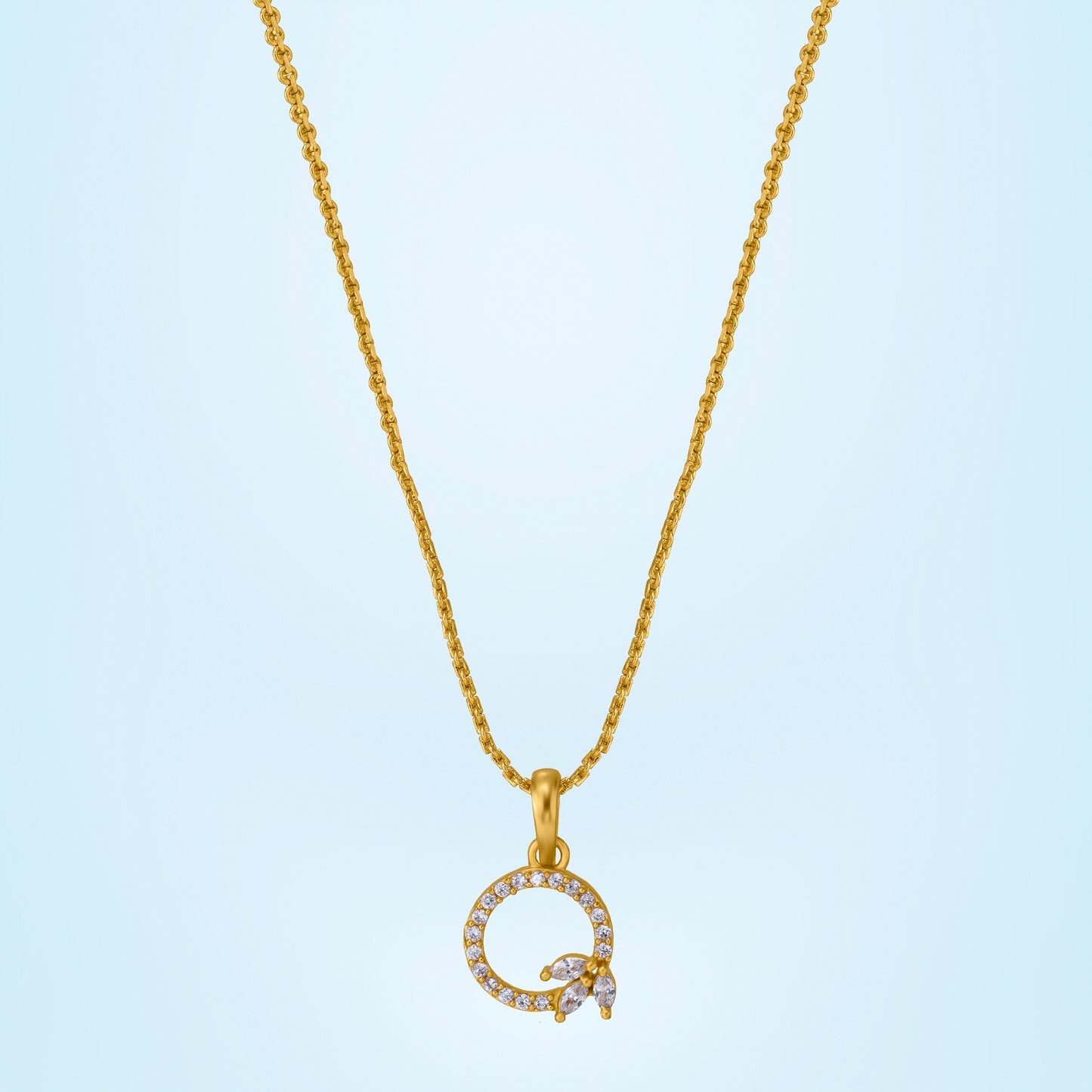 golden necklace with a diamond letter on it