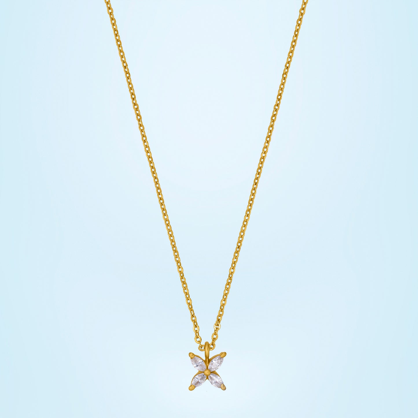 golden necklace with a small white diamond