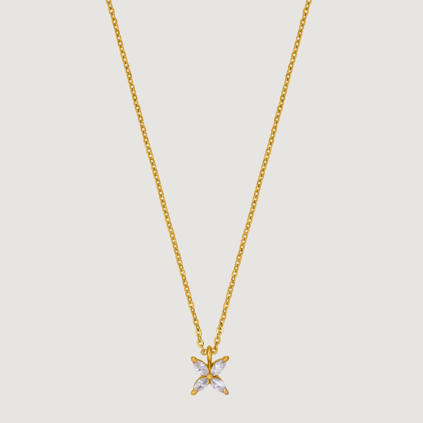 golden necklace with a small white diamond