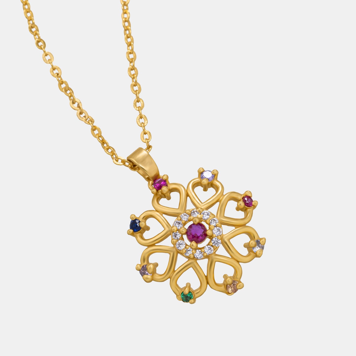 golden necklace with a flower design and multi colored stones