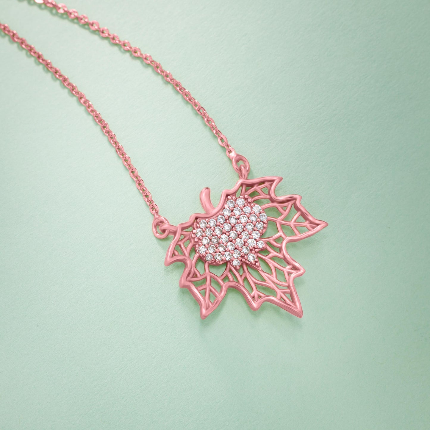 rose gold necklace with a diamond flower pendant