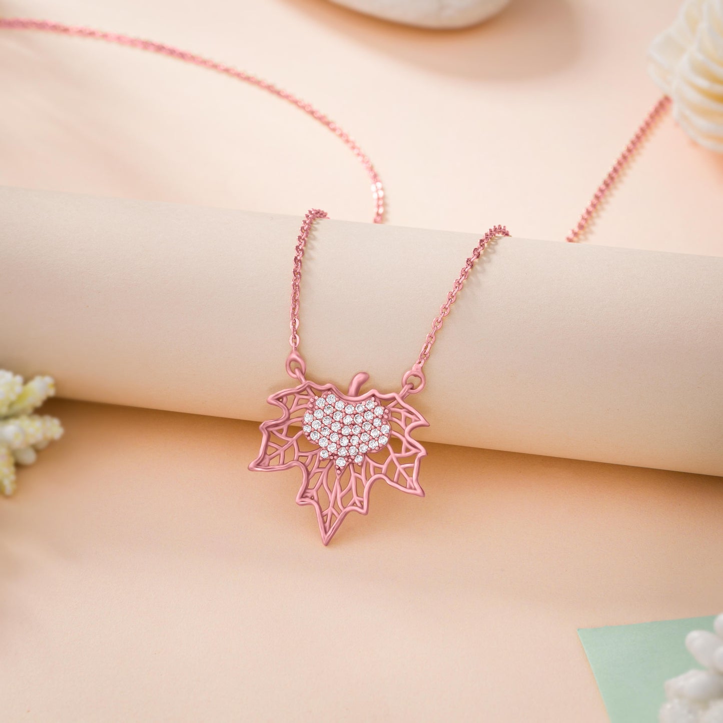 rose gold necklace with a diamond flower pendant