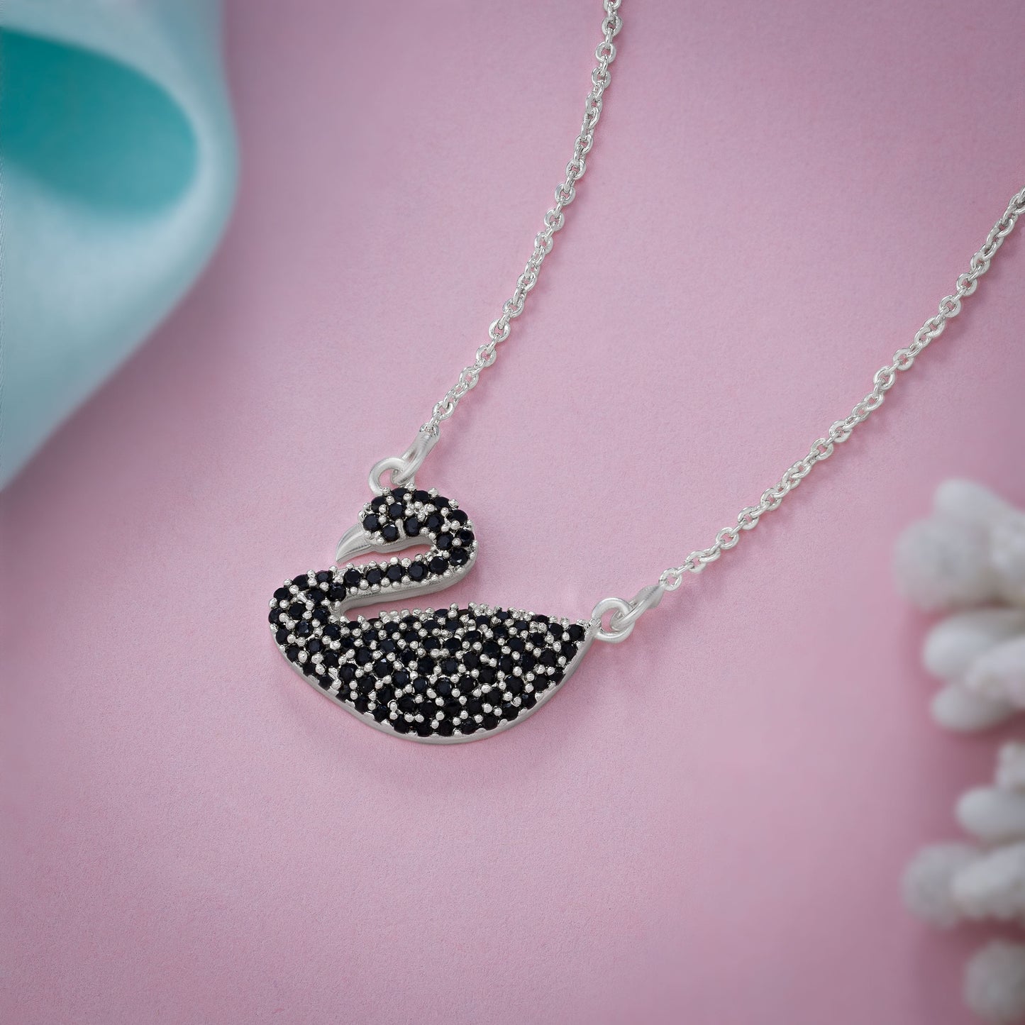 silver necklace with a stone swan