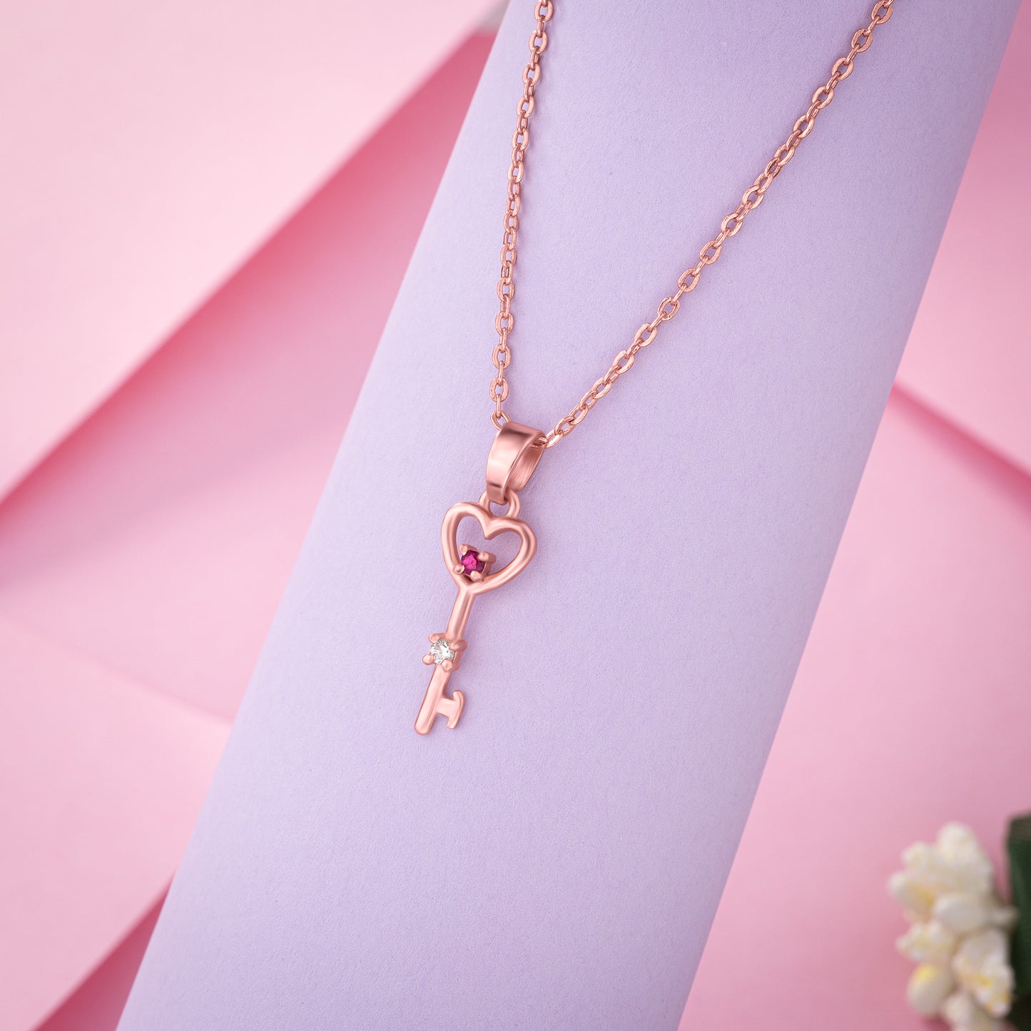 rose gold necklace with a heart and a key