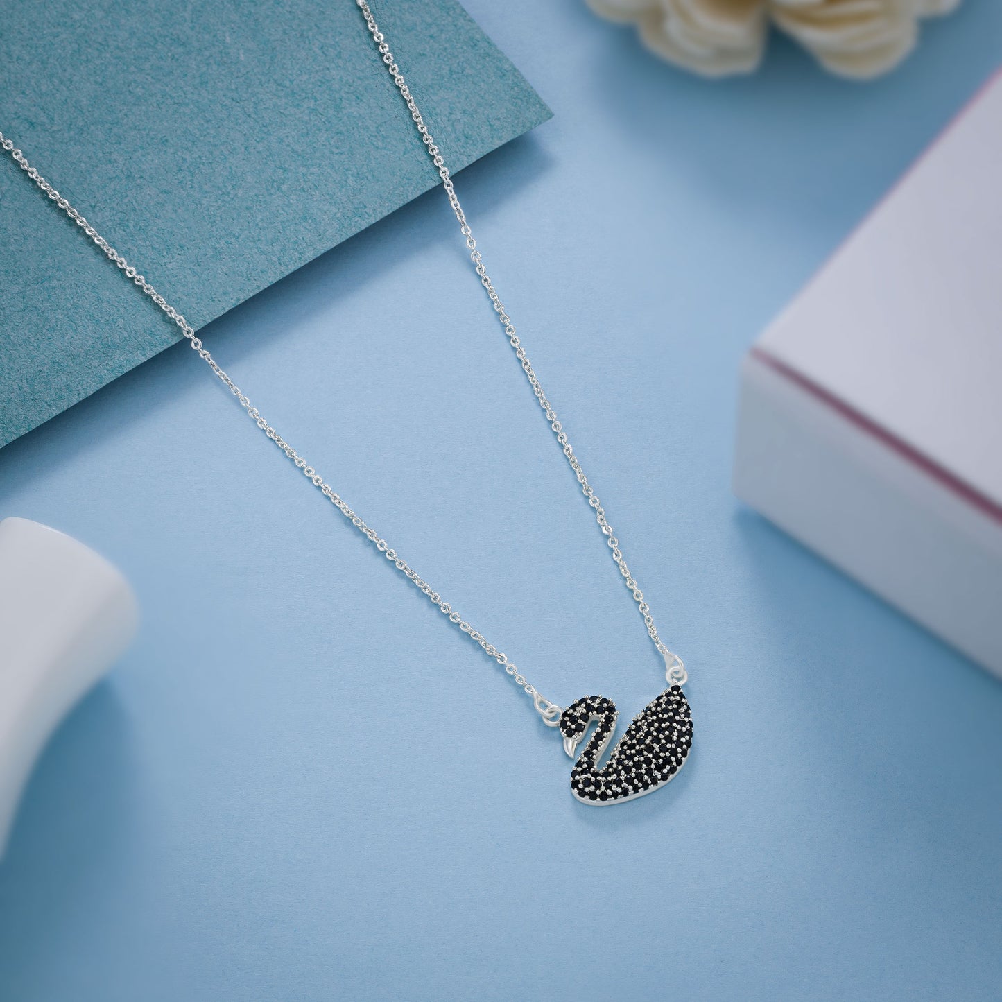 silver necklace with a stone swan