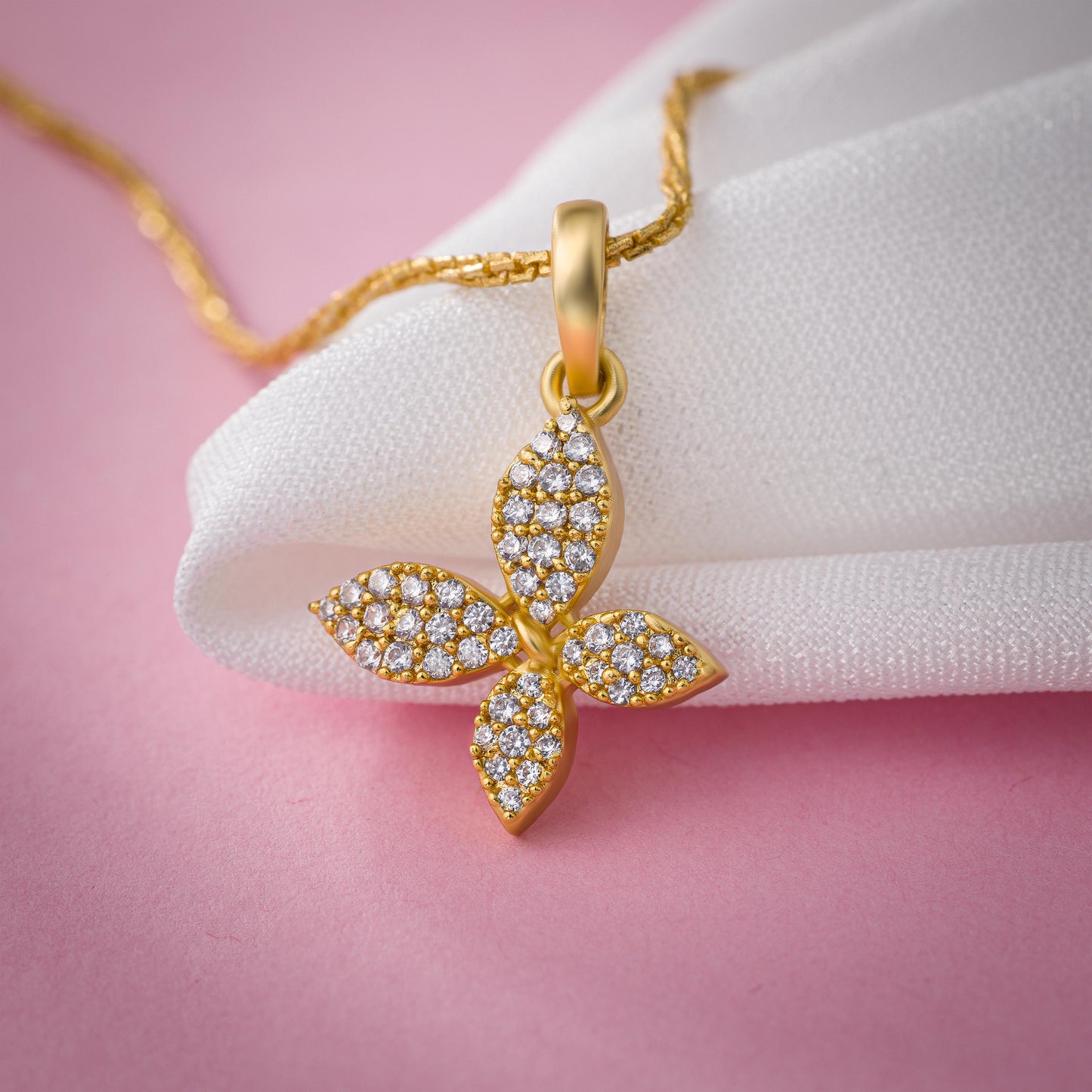 golden necklace with a diamond butterfly pendant