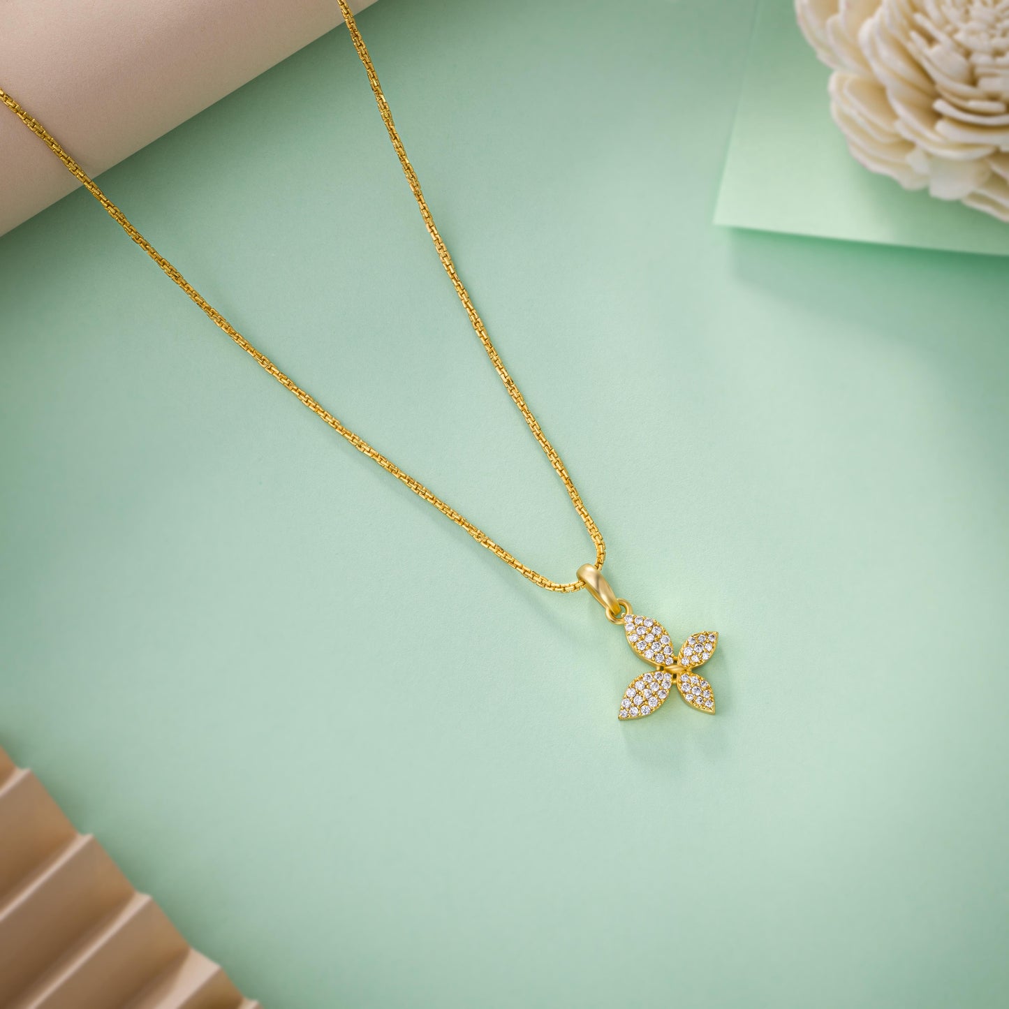 golden necklace with a diamond butterfly pendant