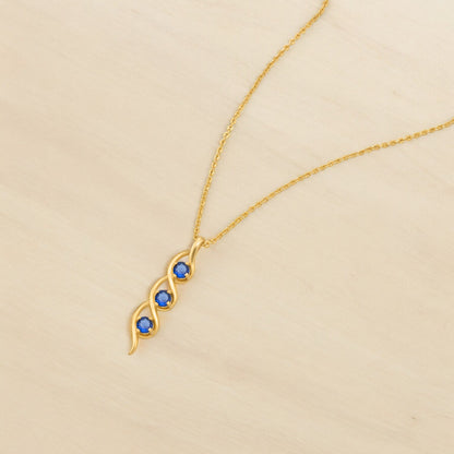 Golden Necklace with a Rainbow Stone Pendant