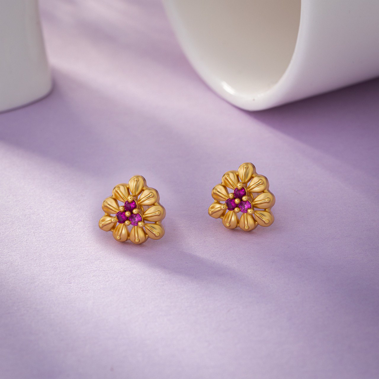 pair of golden and flower earrings