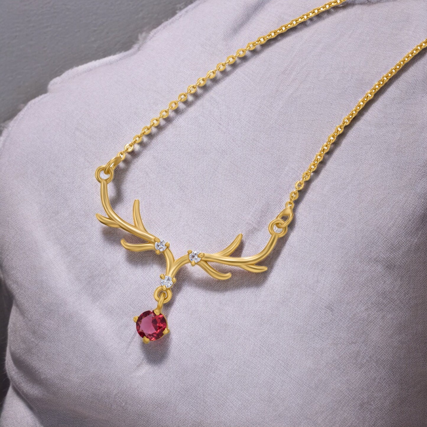 the golden deer necklace with a stone