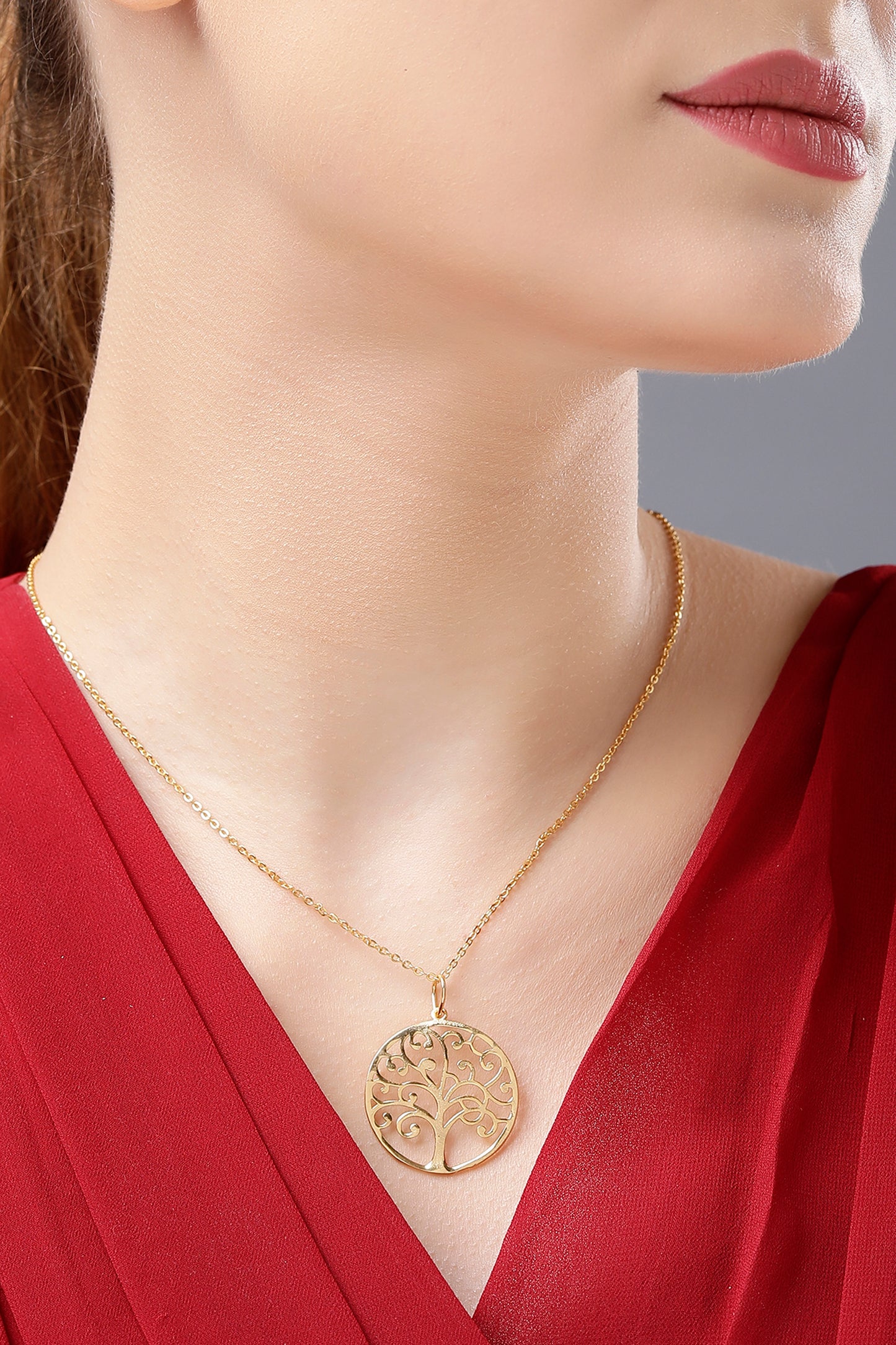 golden necklace with tree of life pendant