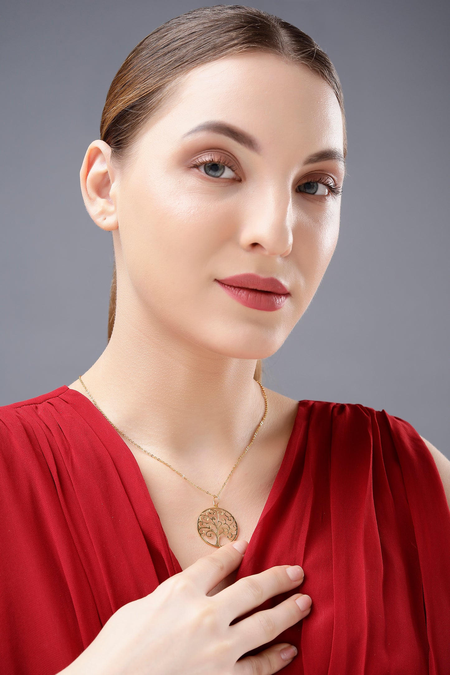 golden necklace with tree of life pendant