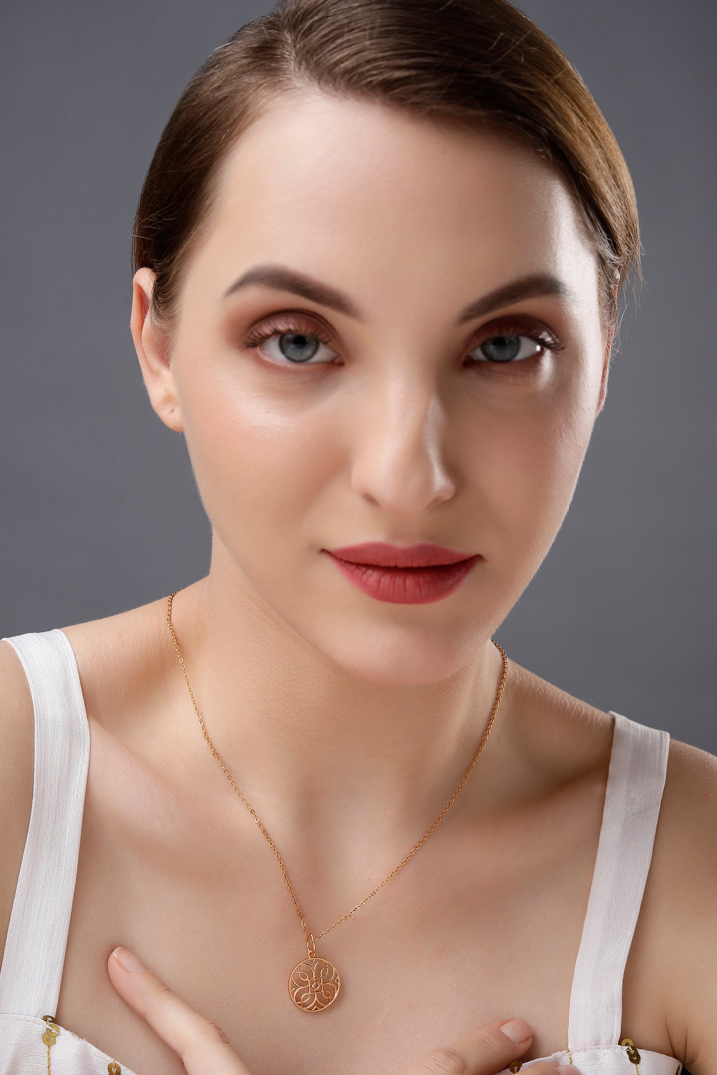 golden necklace with a celtic design pendant