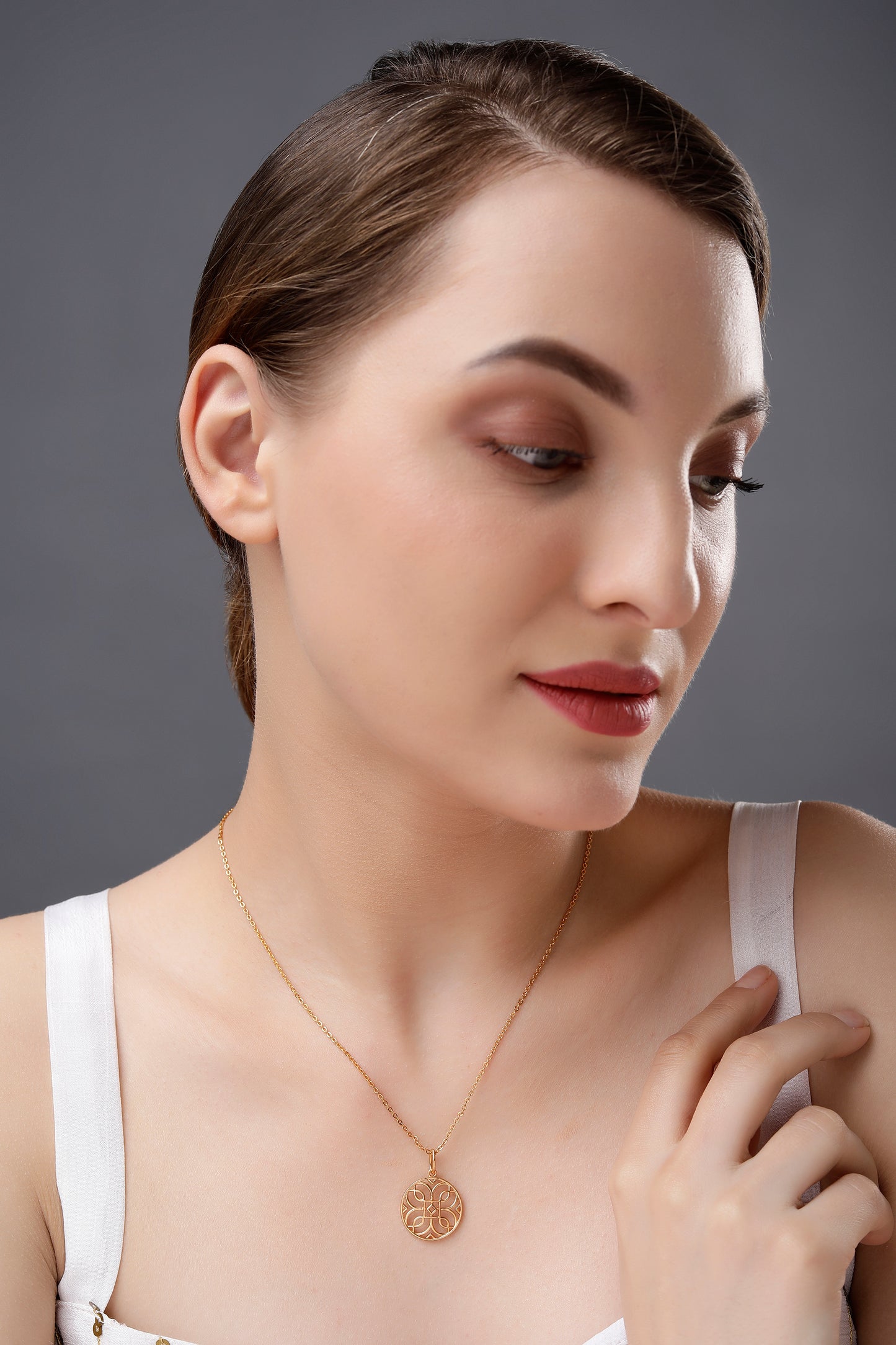 golden necklace with a celtic design pendant