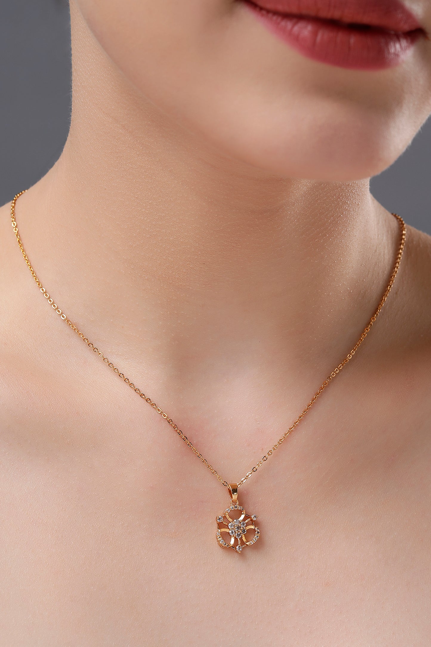 golden necklace with flower pendent