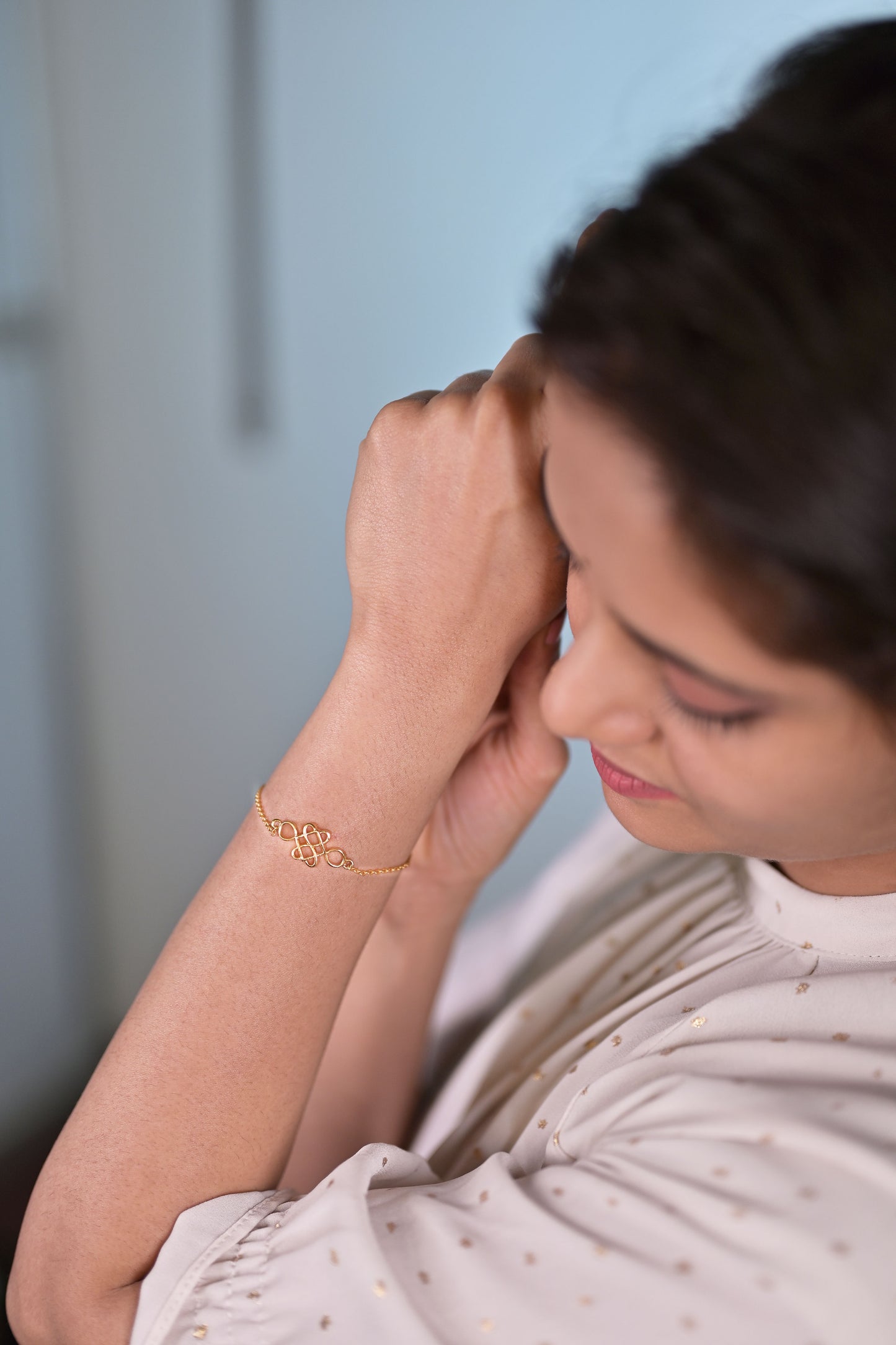 golden bracelet with a beautiful knot