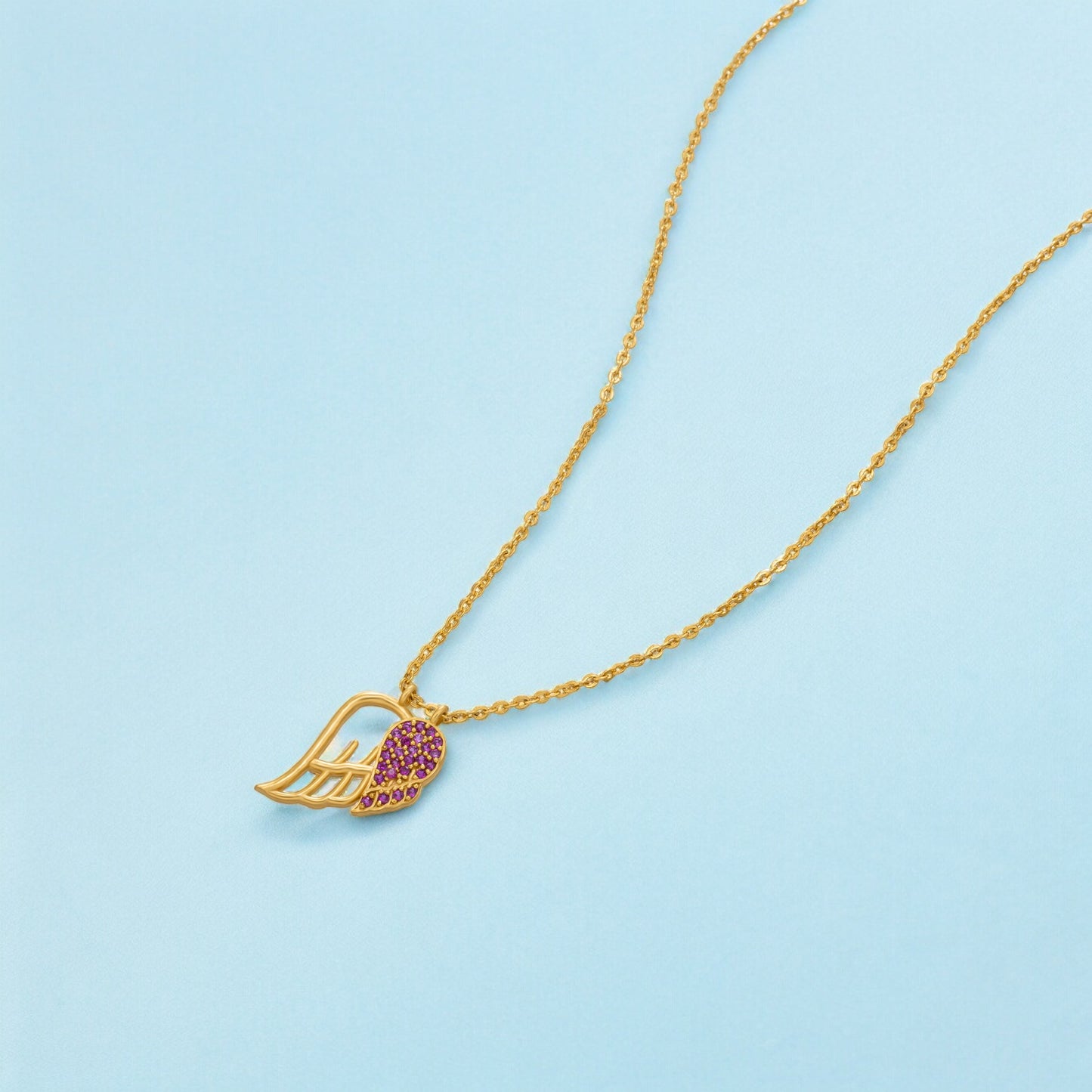 golden necklace with a stone heart