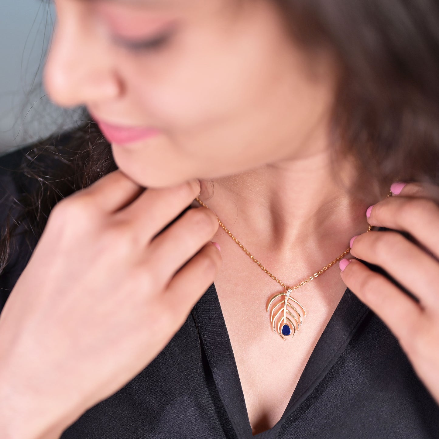 golden necklace with sapphire stone