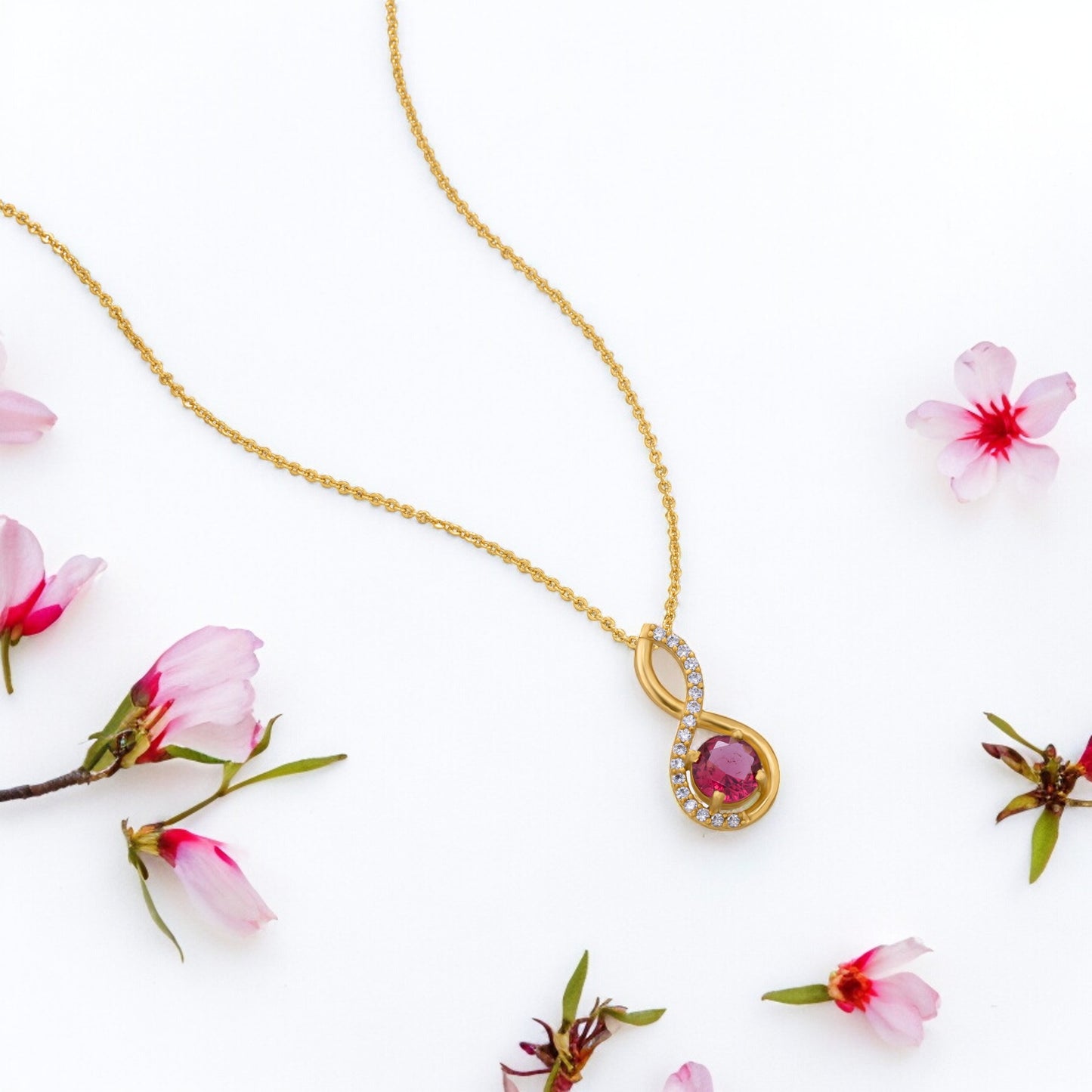 golden necklace with a stone and diamonds