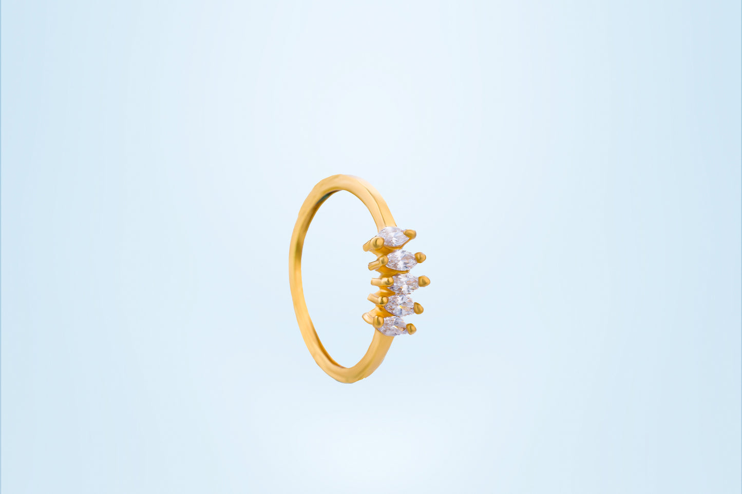 golden ring with white stones