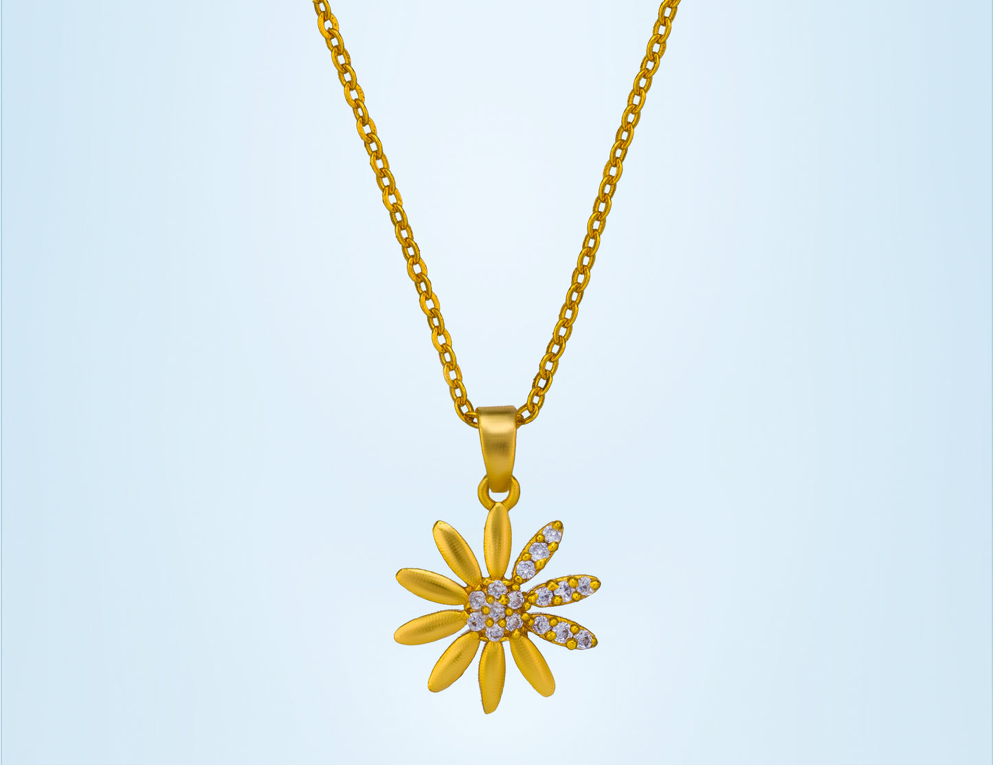 golden necklace with a flower pendant