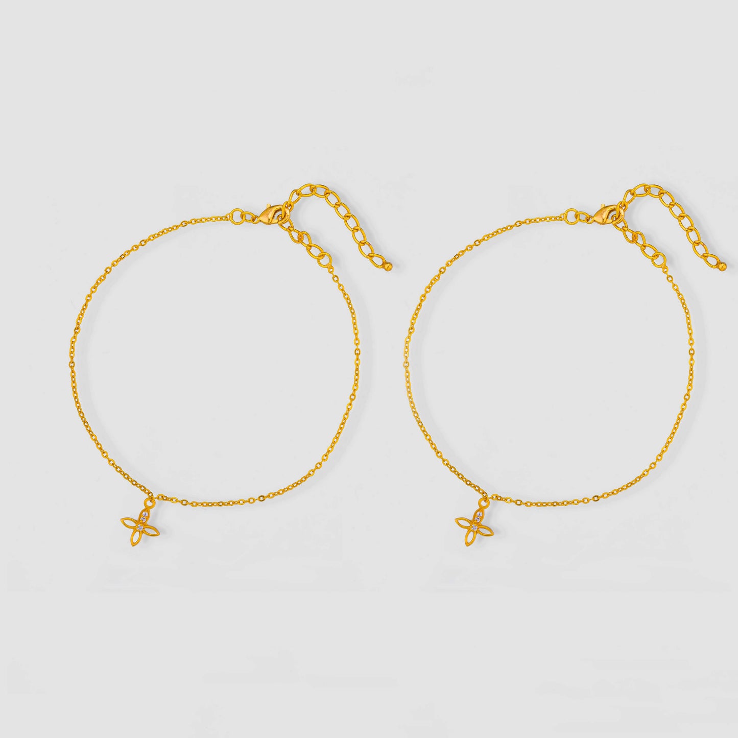 pair of golden anklets with diamonds