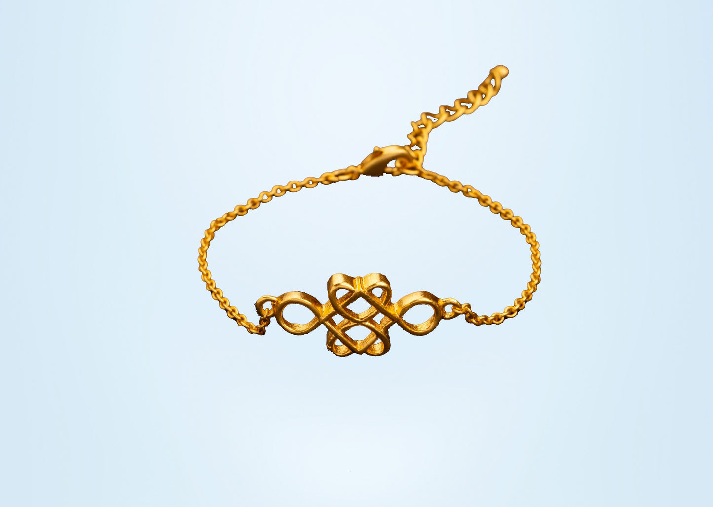 golden bracelet with a beautiful knot