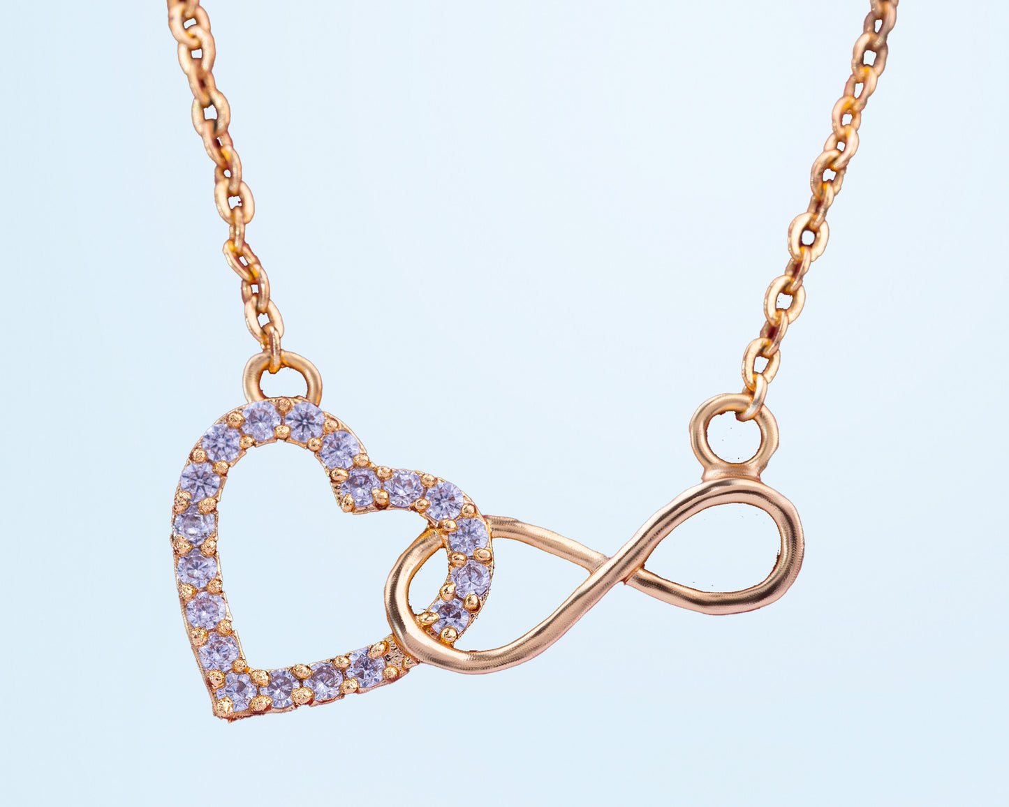 golden necklace with heart and infinity