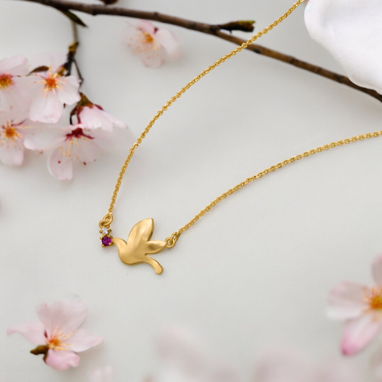 new heights with this enchanting golden bird necklace