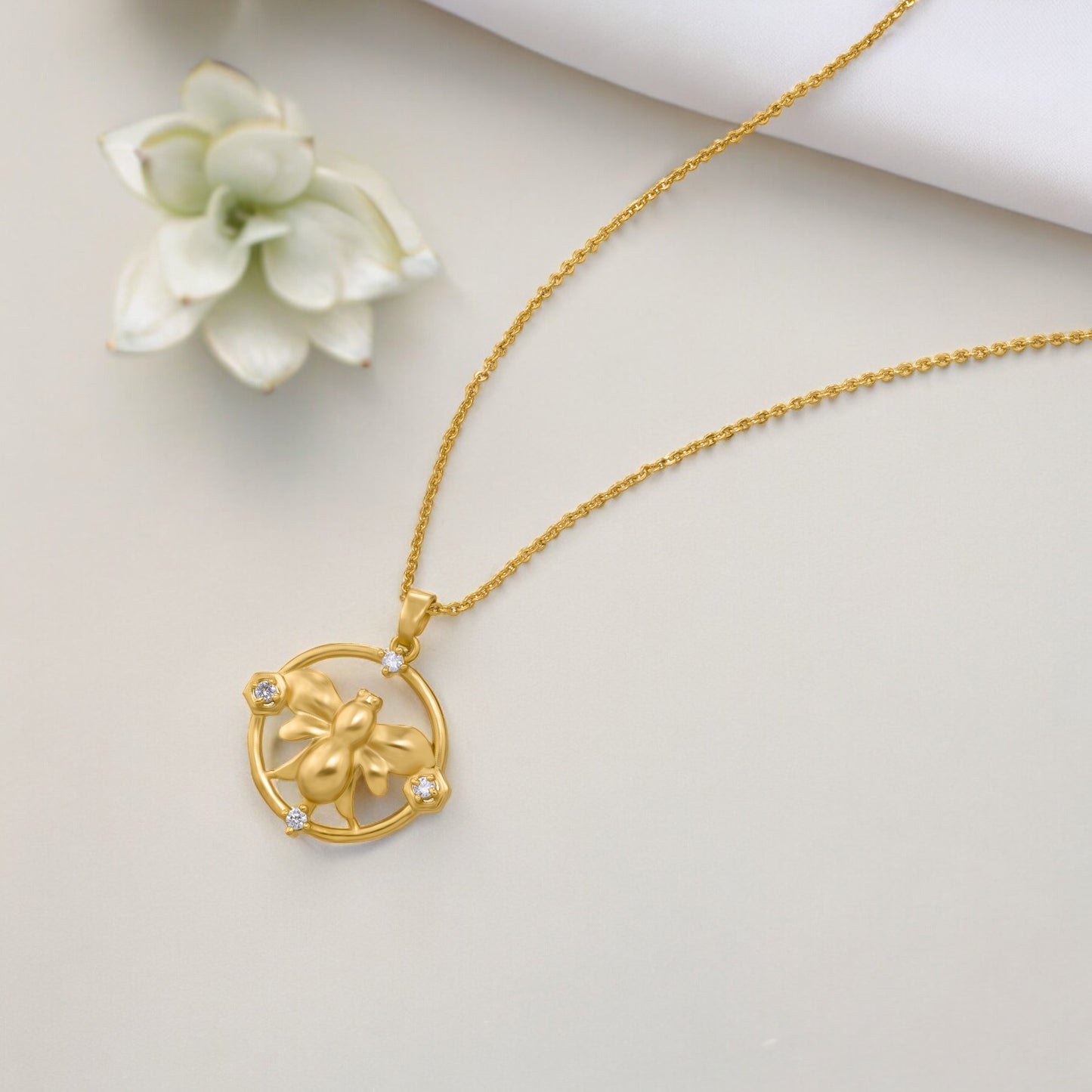 golden necklace with a turtle on it