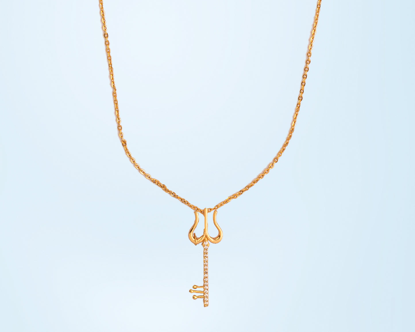 golden necklace with a diamond pendant