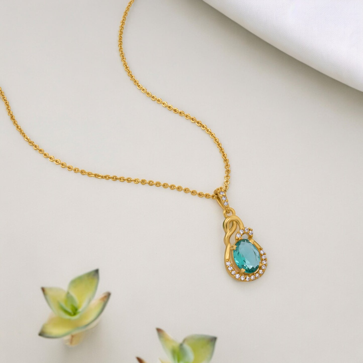 golden necklace with a stone and diamonds