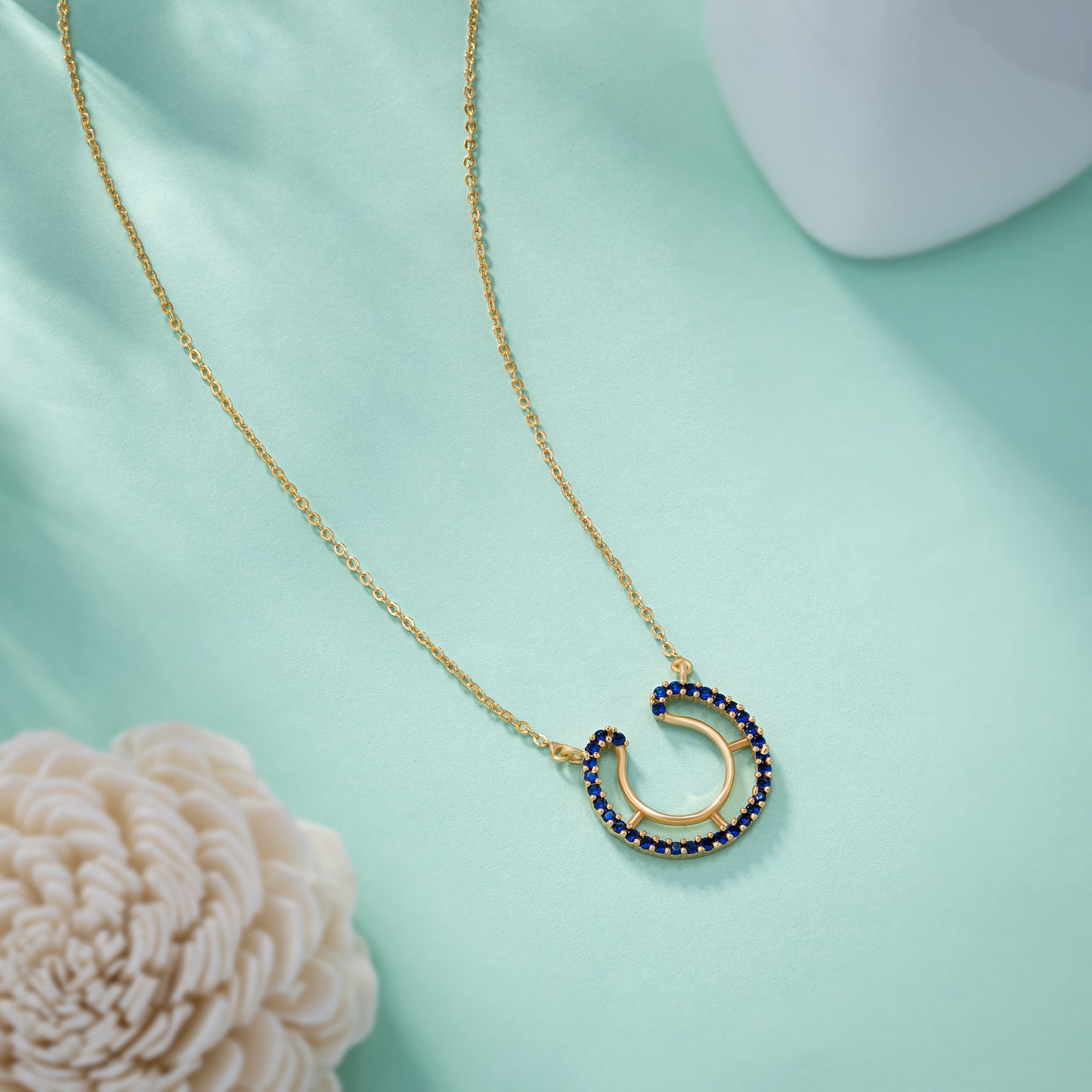 luck with this stunning blue golden horseshoe necklace