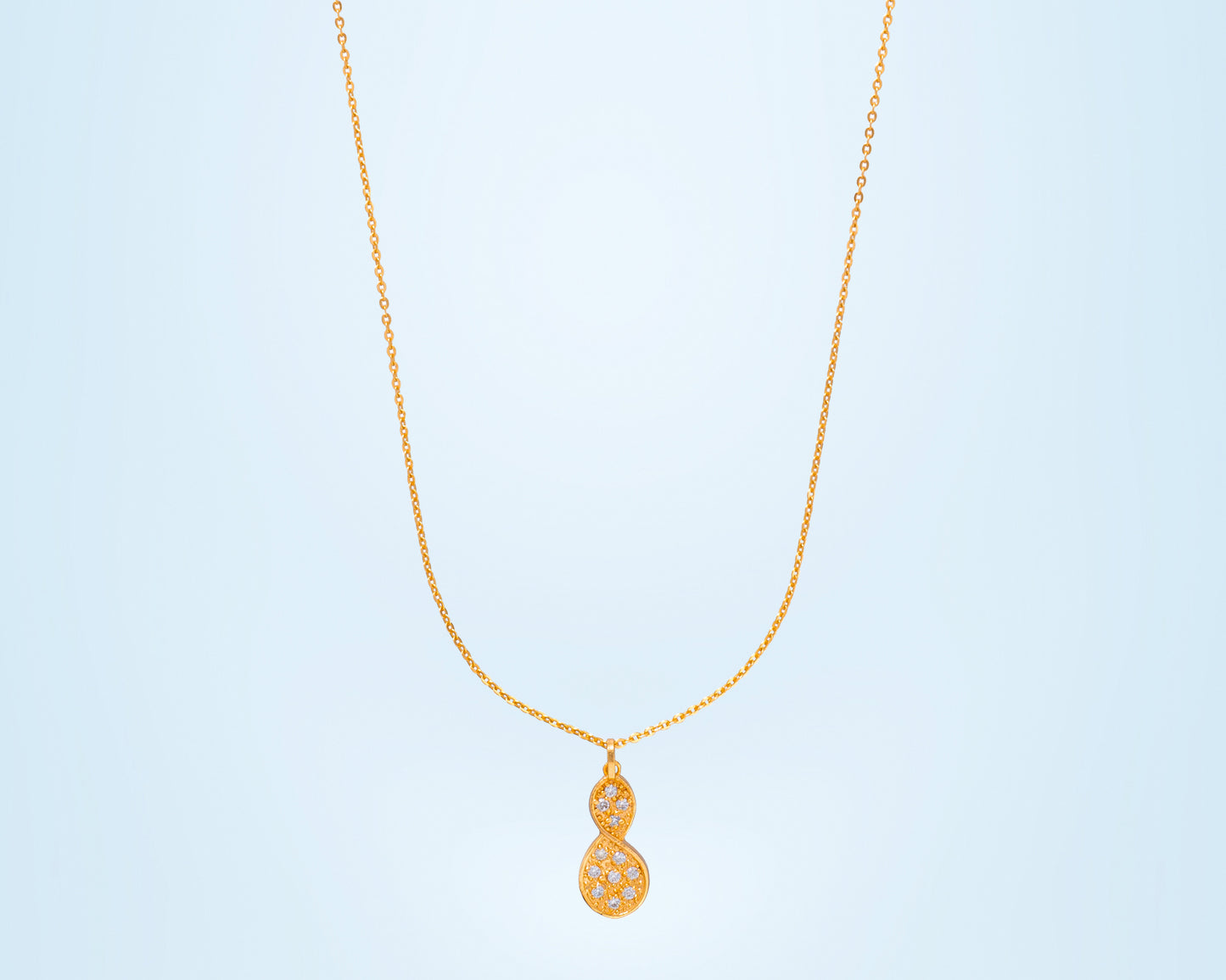 golden necklace with a diamond tear