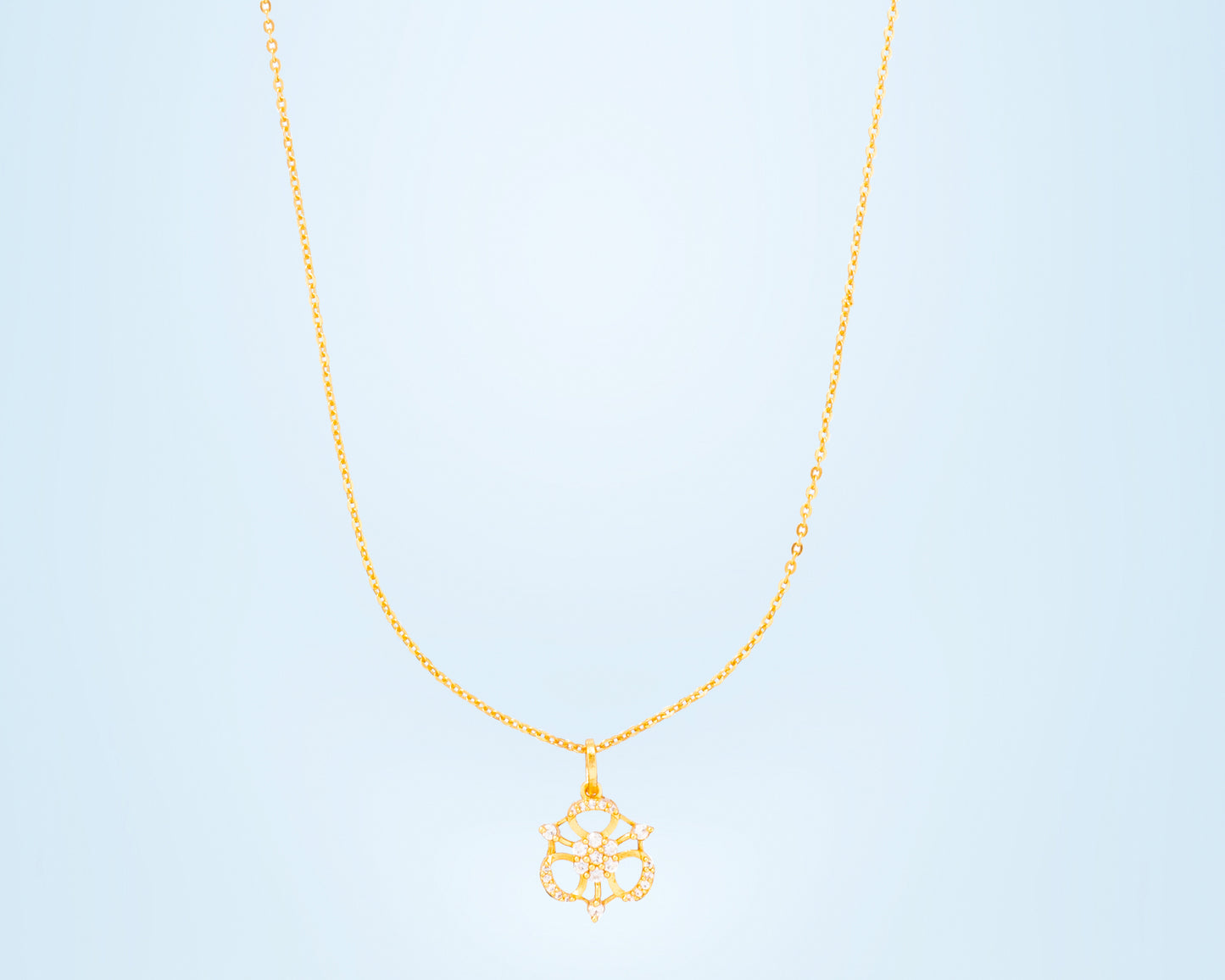 golden necklace with flower pendent