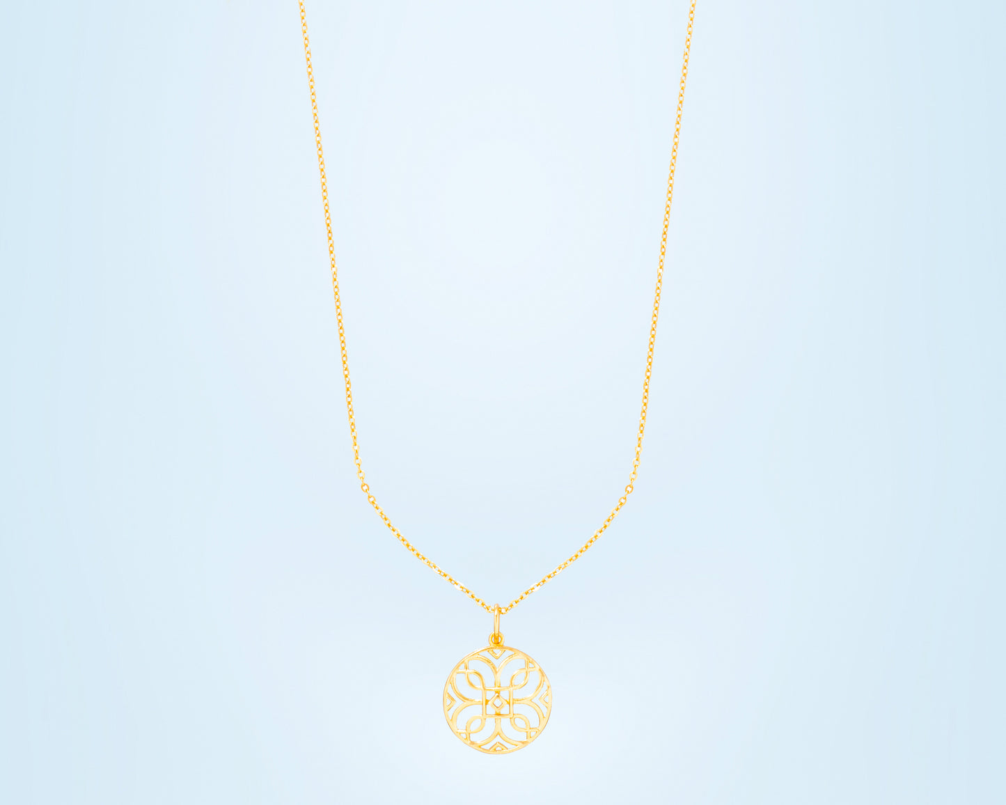 golden necklace with a celtic design pendant