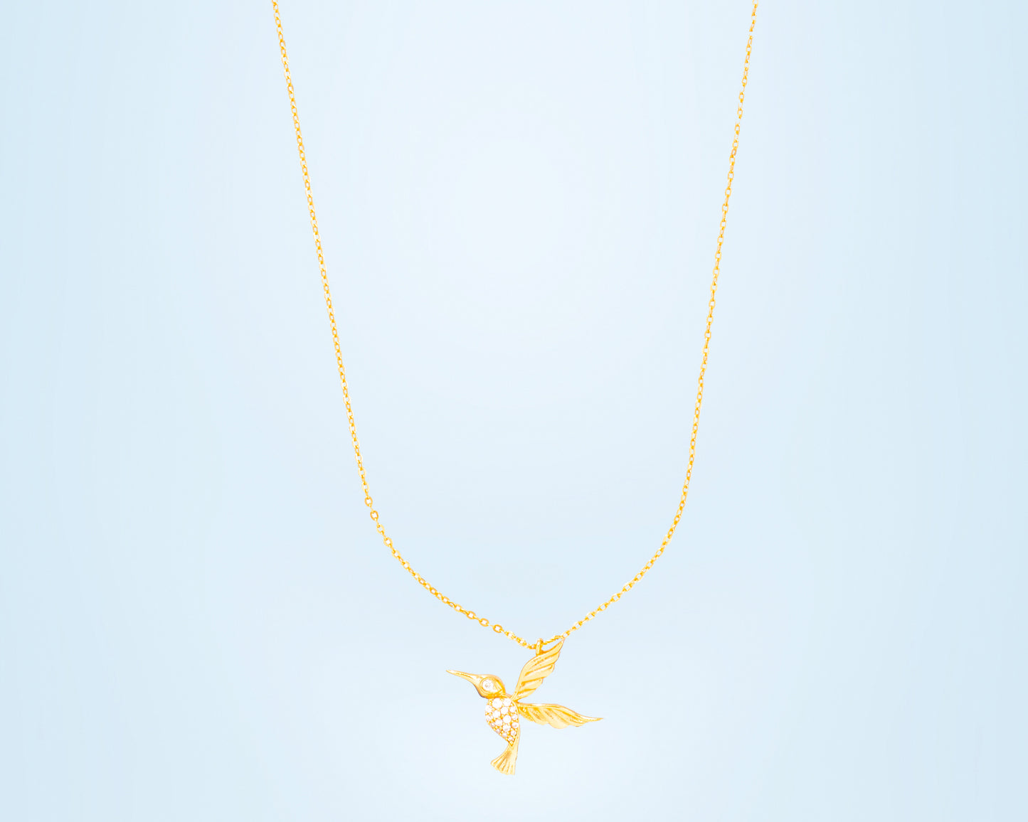 golden humming necklace with diamonds