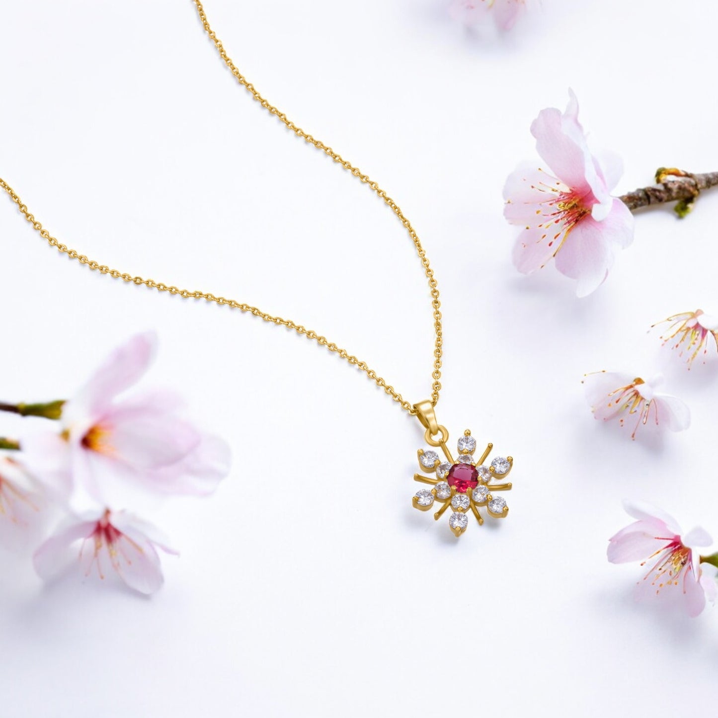 golden necklace with a stone and diamonds