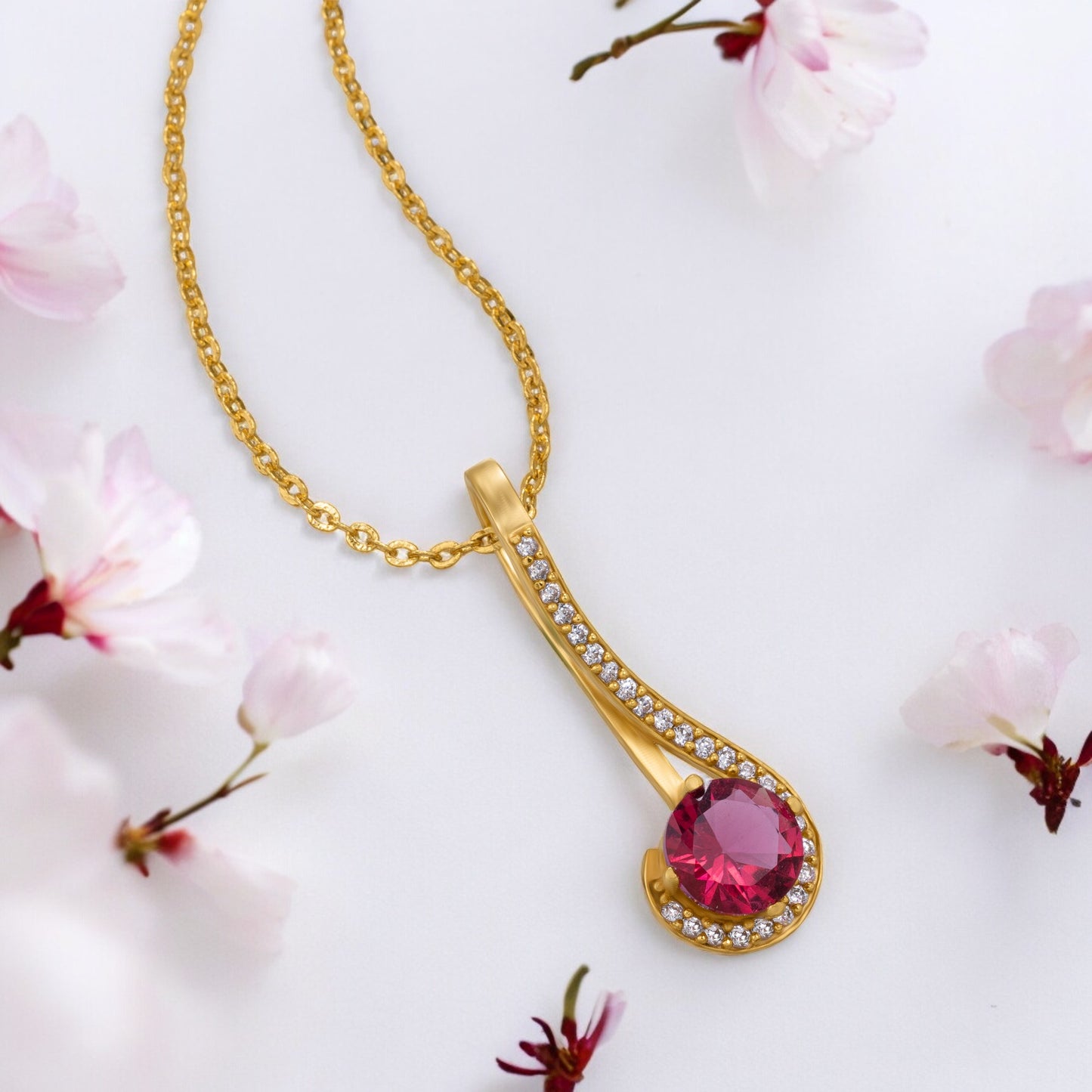 golden necklace with a stone and diamonds