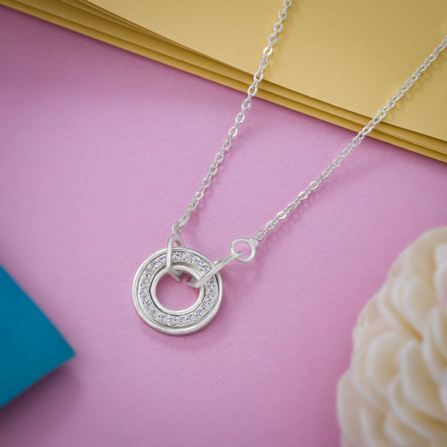 silver necklace with a diamond circle